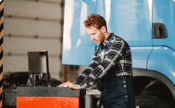 Diagnostician performing a registration inspection of a truck